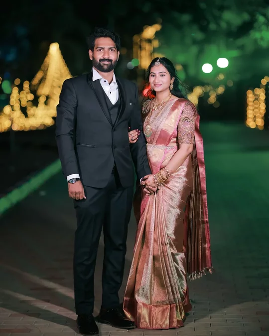 Groom and bride in silk saree at night reception