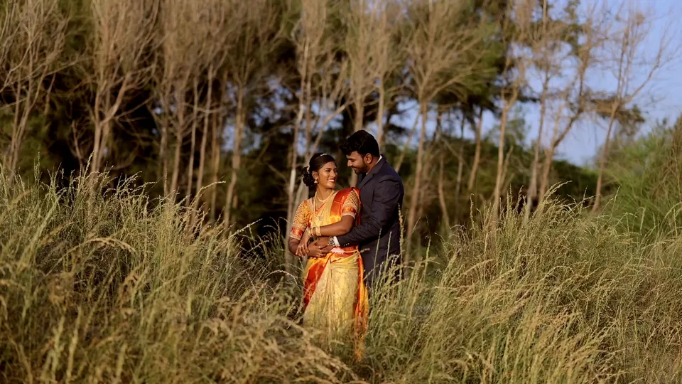 Couple in golden grass from wedding highlight by Allwin Raj photography